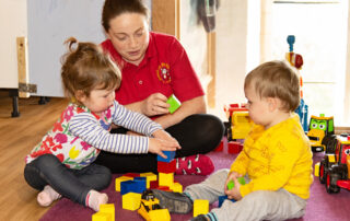 building blocks with staff and children