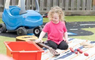 Child enjoying outside space at Monkey Puzzle Ware